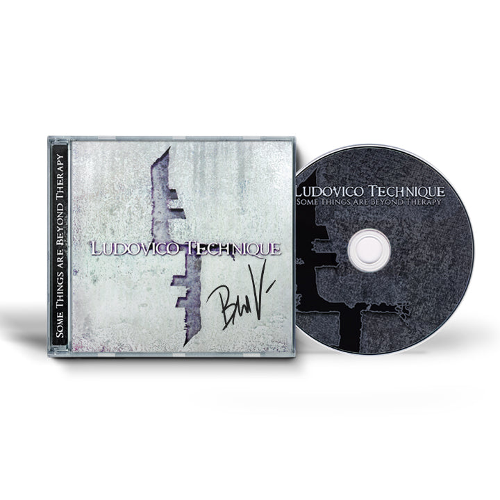 CD and signed cover of 'Ludovico Technique Some Things Are Beyond Therapy' album on a white background